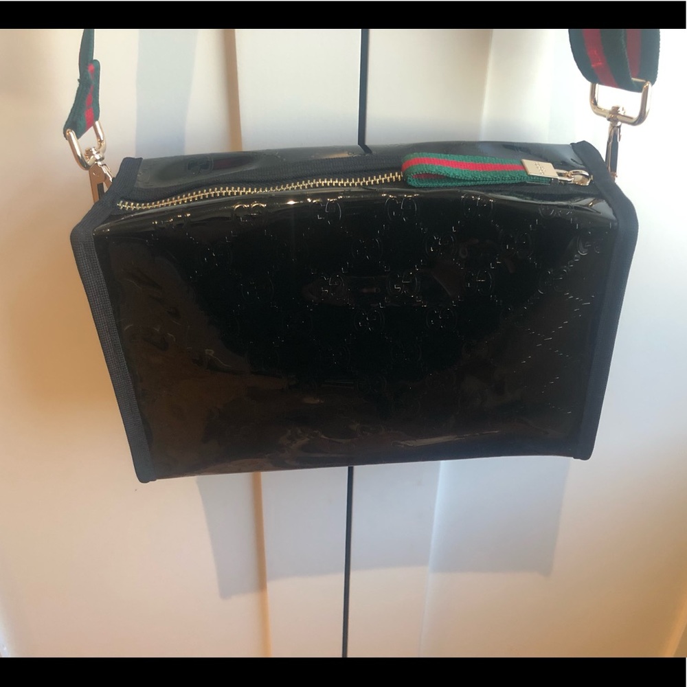 - Gucci cosmetic bag